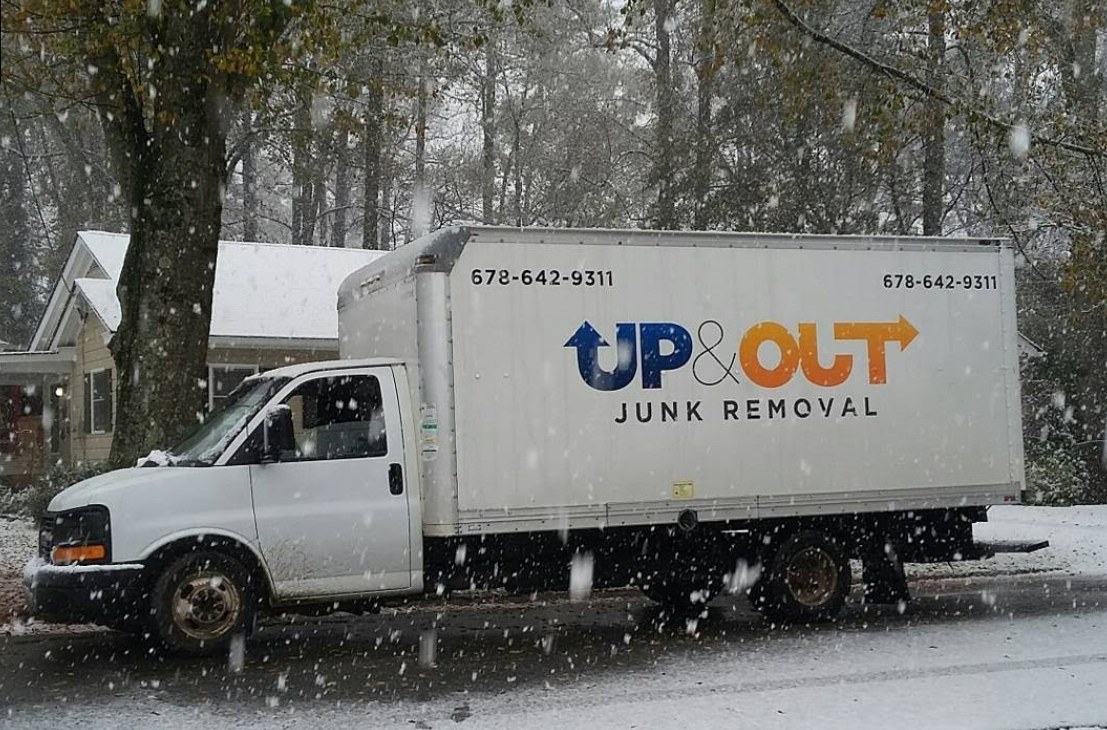 Up & Out Junk Removal box truck out working on a snowy day near Hiram, GA